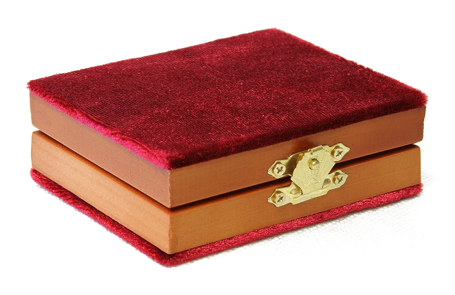 The folding diptych closed in its red velvet cover, clasp side