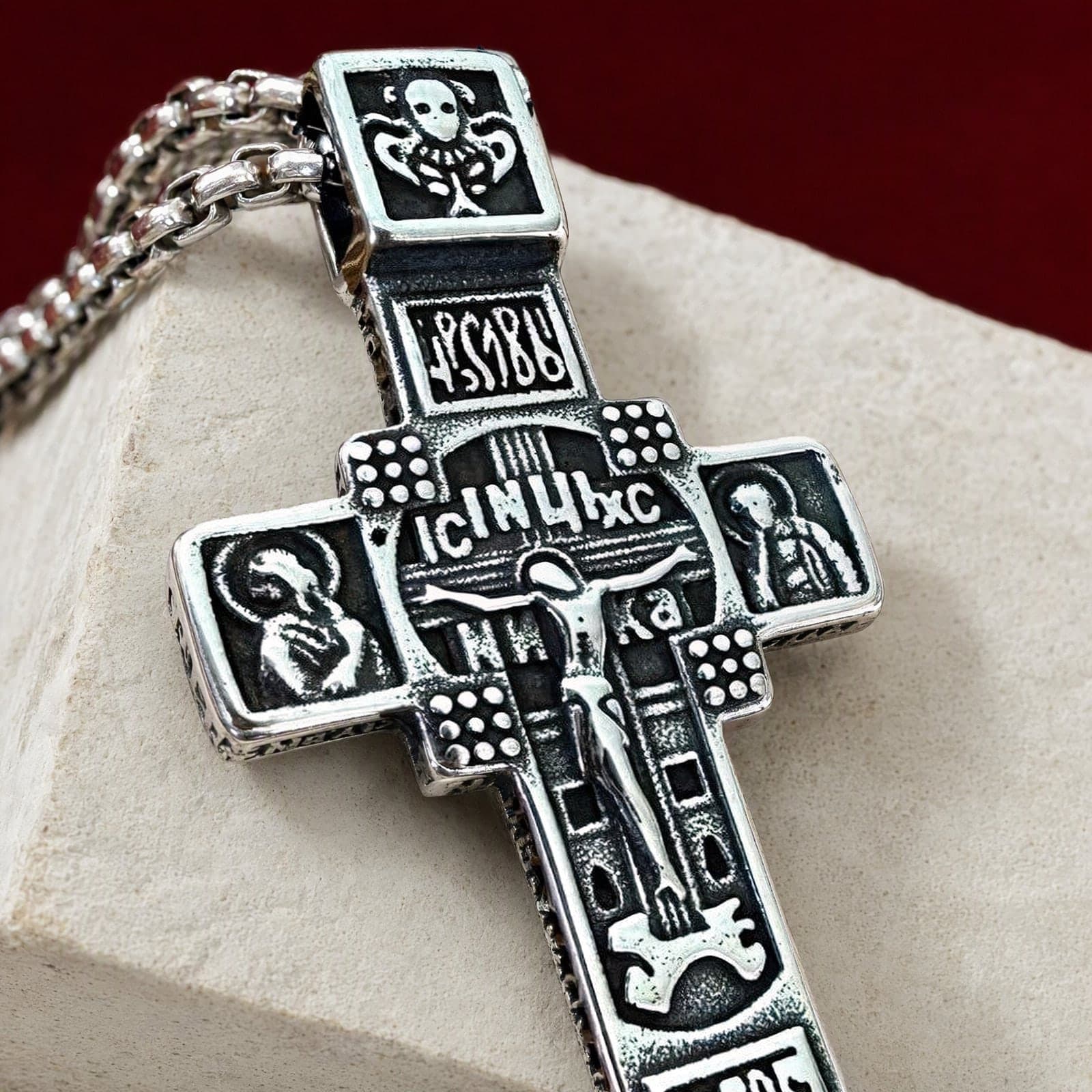 Close-up of the Orthodox Crucifix (Studded) - Silver Color - 60cm Chain - Stainless Steel Cross: the relief and the bail in raking light.