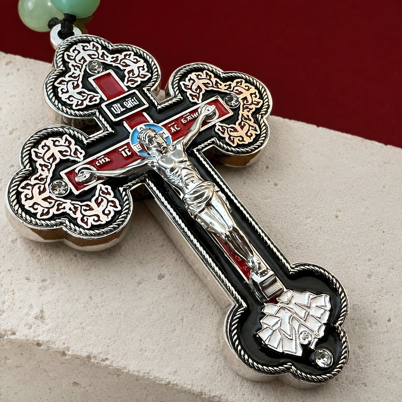 Close-up of the Orthodox Crucifix - Silver Color - Cross: the relief and the bail in raking light.