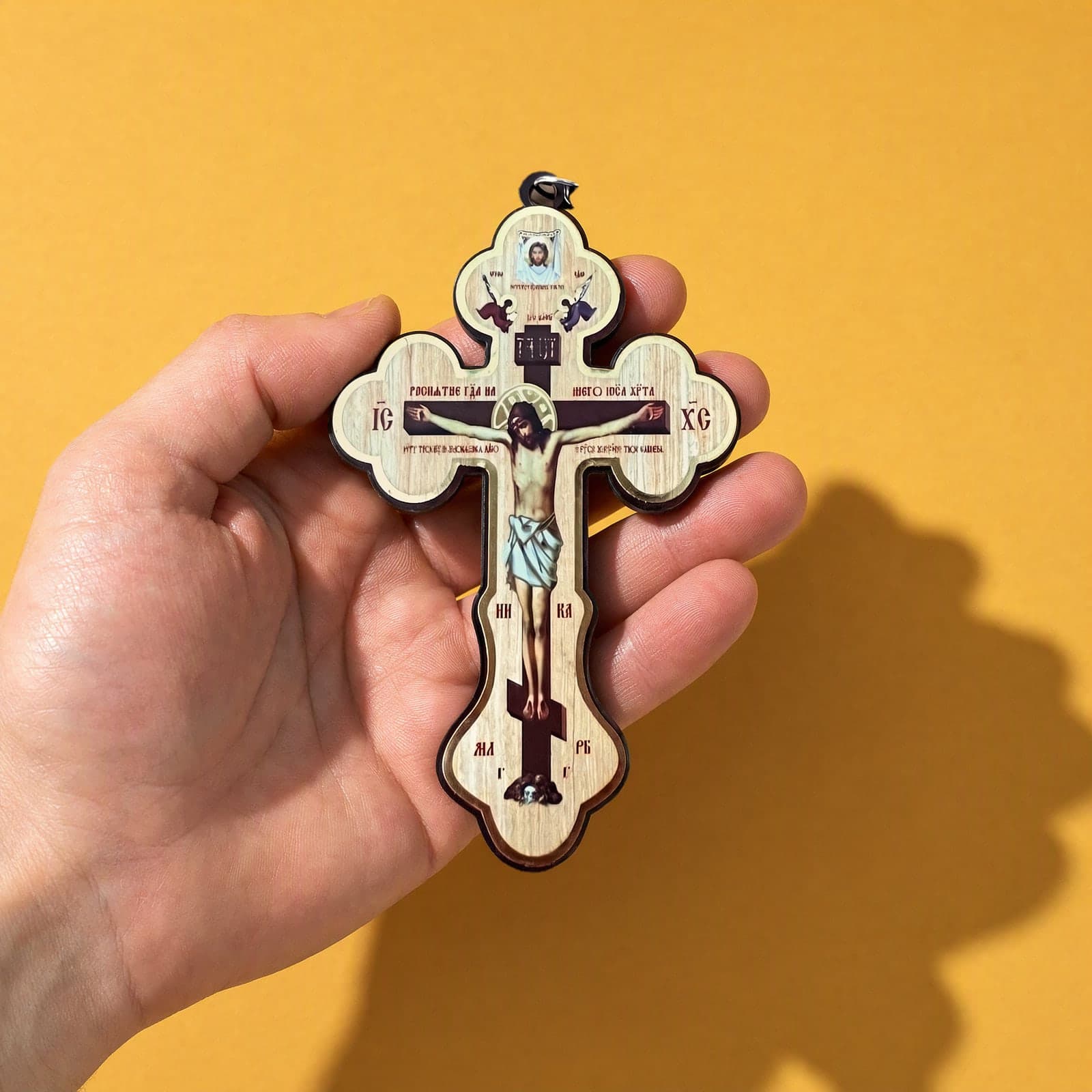 Orthodox Crucifix (Budded) - Wooden Cross 10cm held in one hand to show its size (10.0 cm).