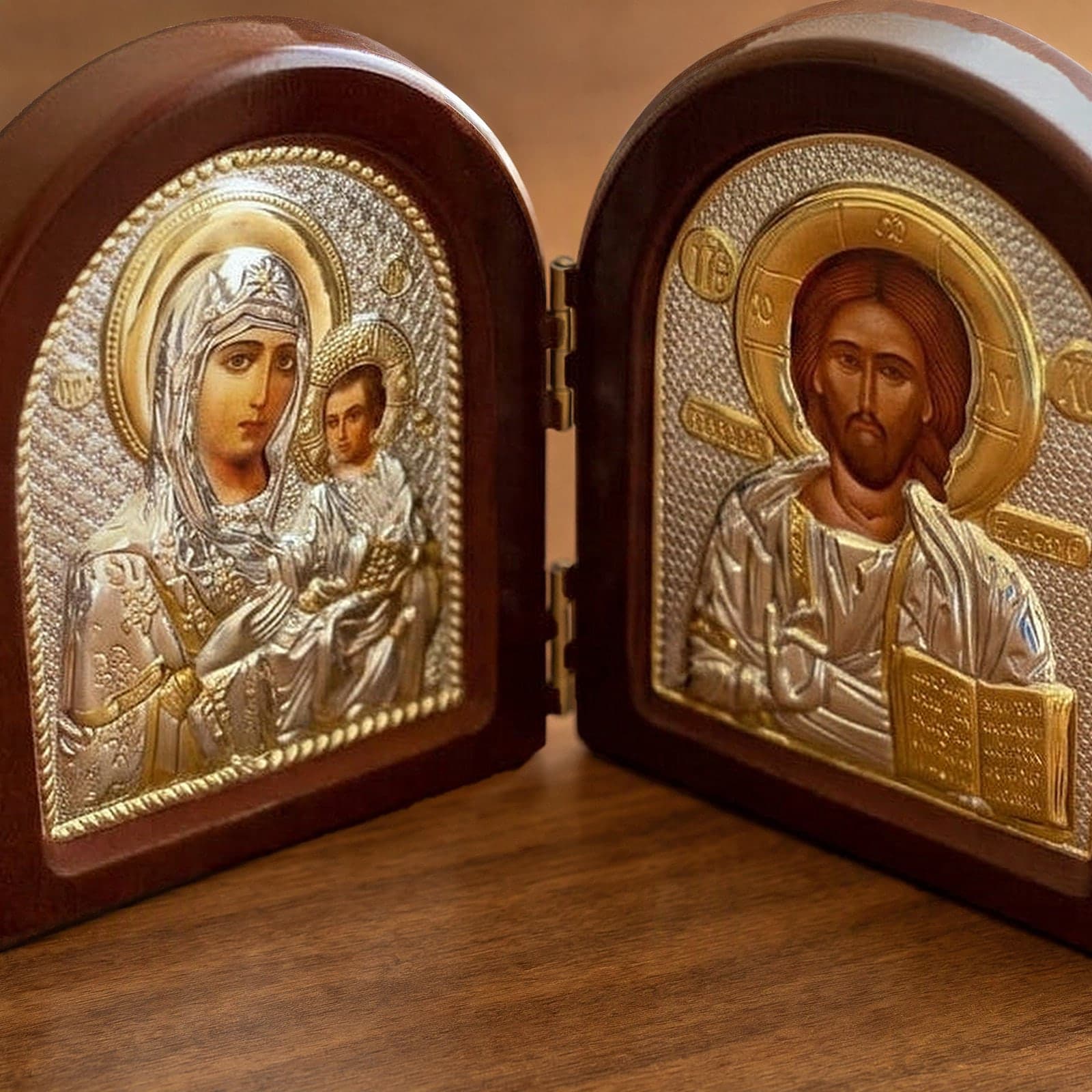 Close-up of the Orthodox Jesus Christ and Virgin Mary - Folding Wooden Icon: the face, halo and finish.