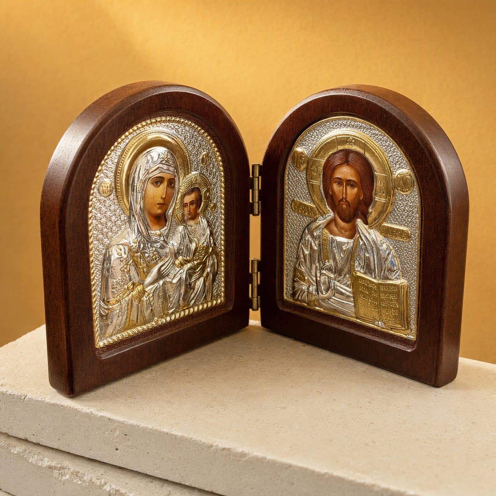 Orthodox Jesus Christ and Virgin Mary, folding wooden icon: close-up of the holy image, the foil and the frame.