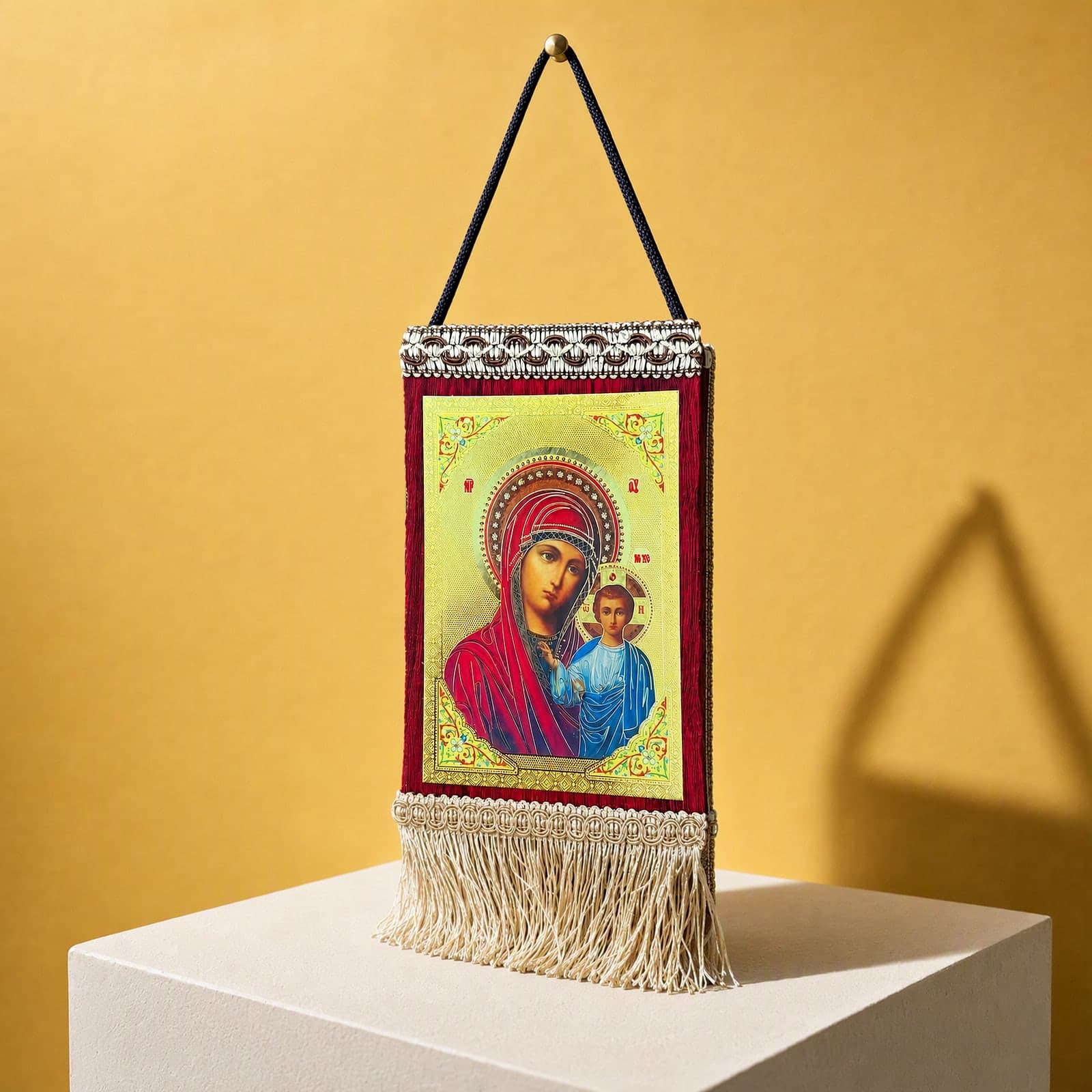 Orthodox Virgin Mary & Jesus - Hanging Icon 20x13cm seen from a 45-degree angle on a white plinth.