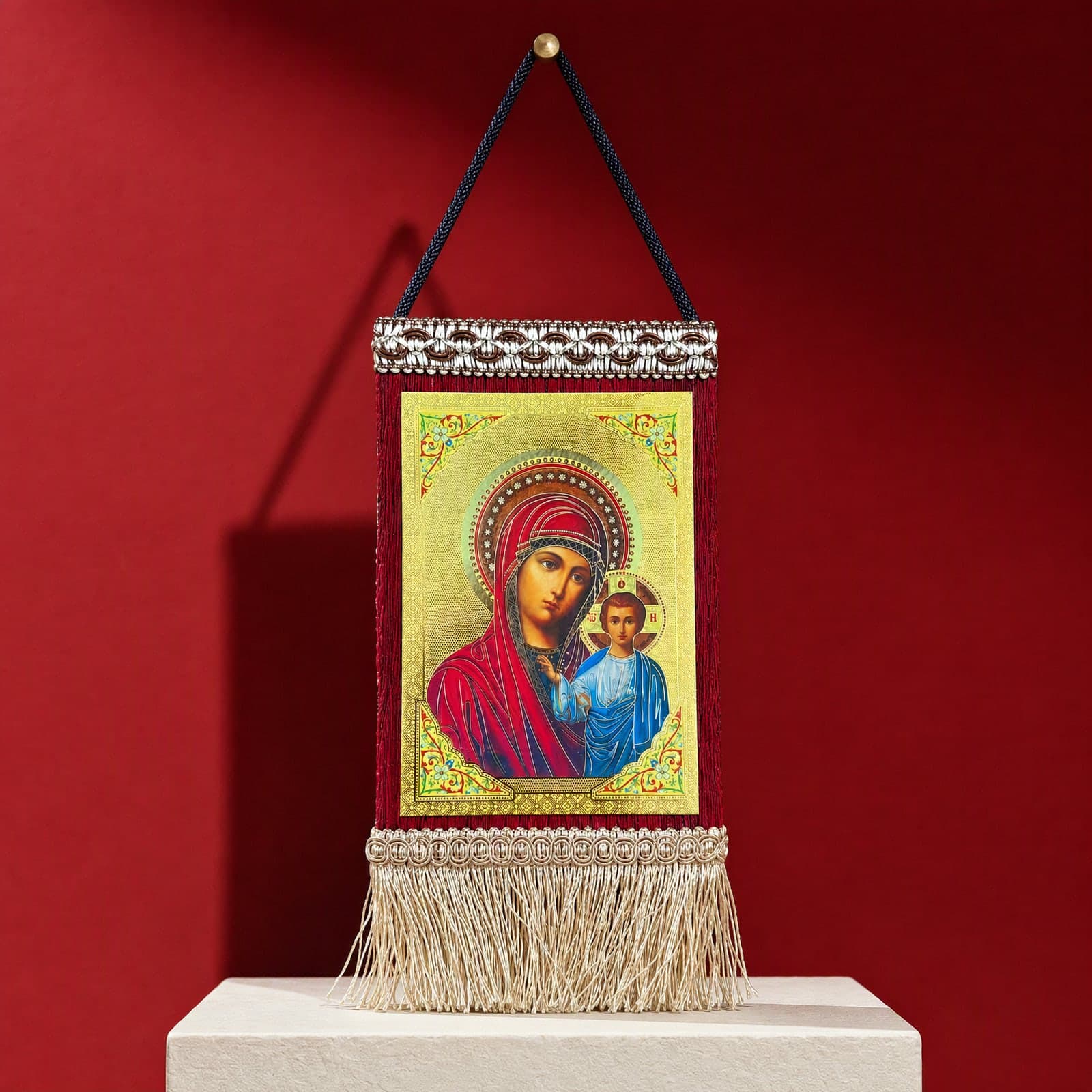 Orthodox Virgin Mary & Jesus, hanging icon (20 × 13 cm), standing on a bone plaster plinth against an oxblood backdrop.
