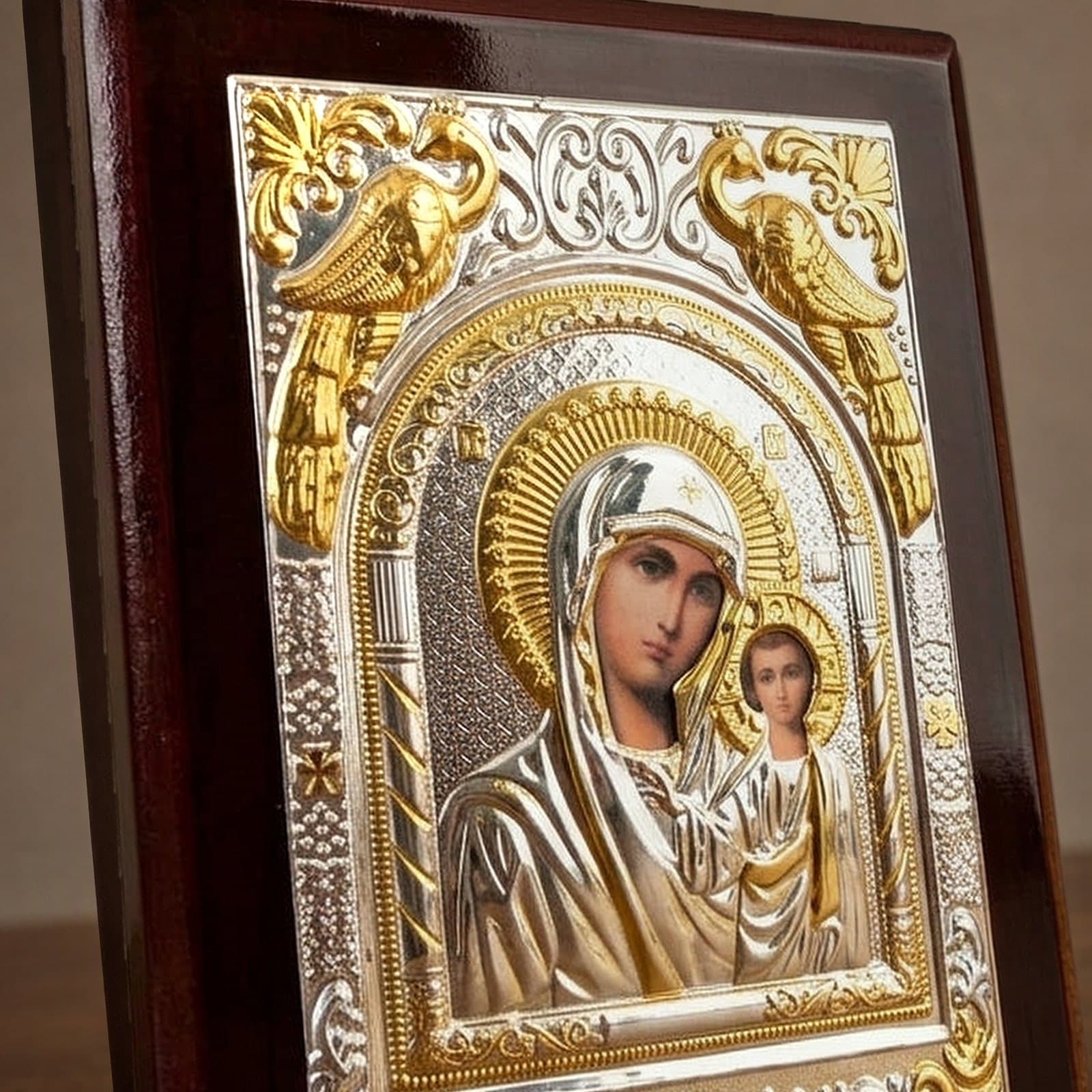 Close-up of the Orthodox Virgin Mary (Our Lady of Kazan, Rectangular) - Silver&Gold Color - Wooden Icon: the face, halo and finish.
