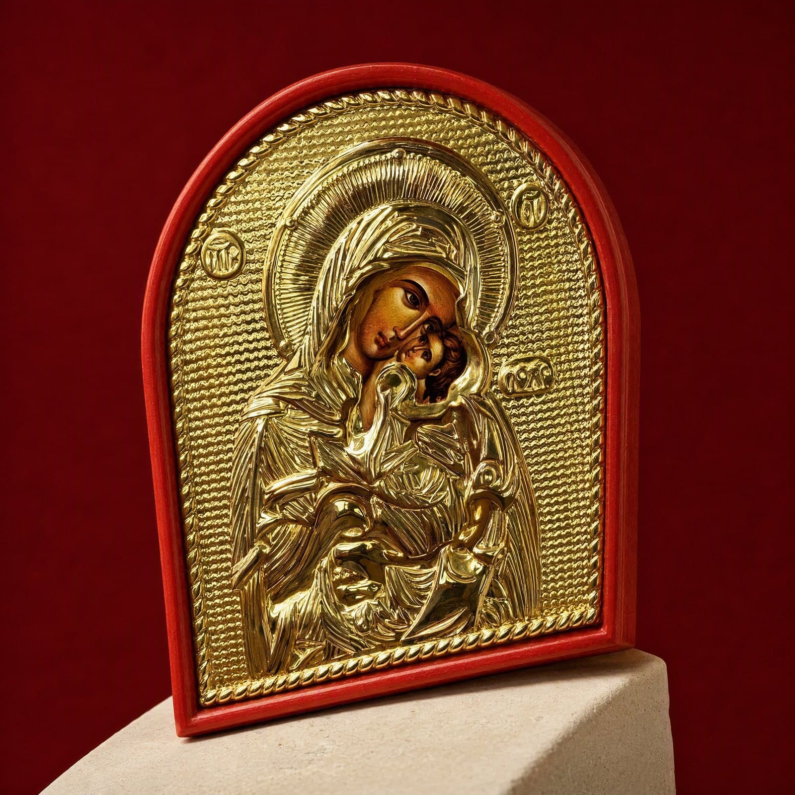 Orthodox Mother of God, gold-tone wooden icon: close-up of the holy image, the foil and the frame.