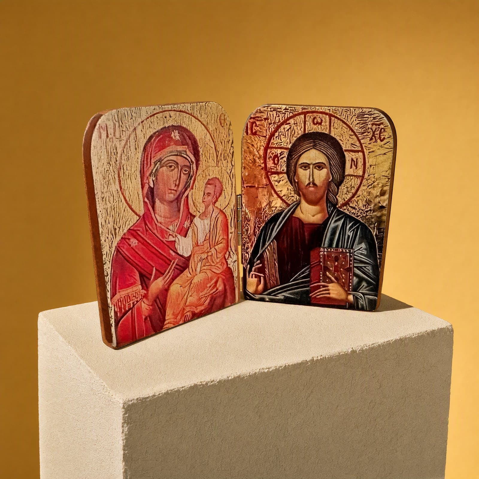 Orthodox Diptych Virgin Mary & Jesus Christ - Folding Wooden Icon seen from a 45-degree angle on a white plinth.