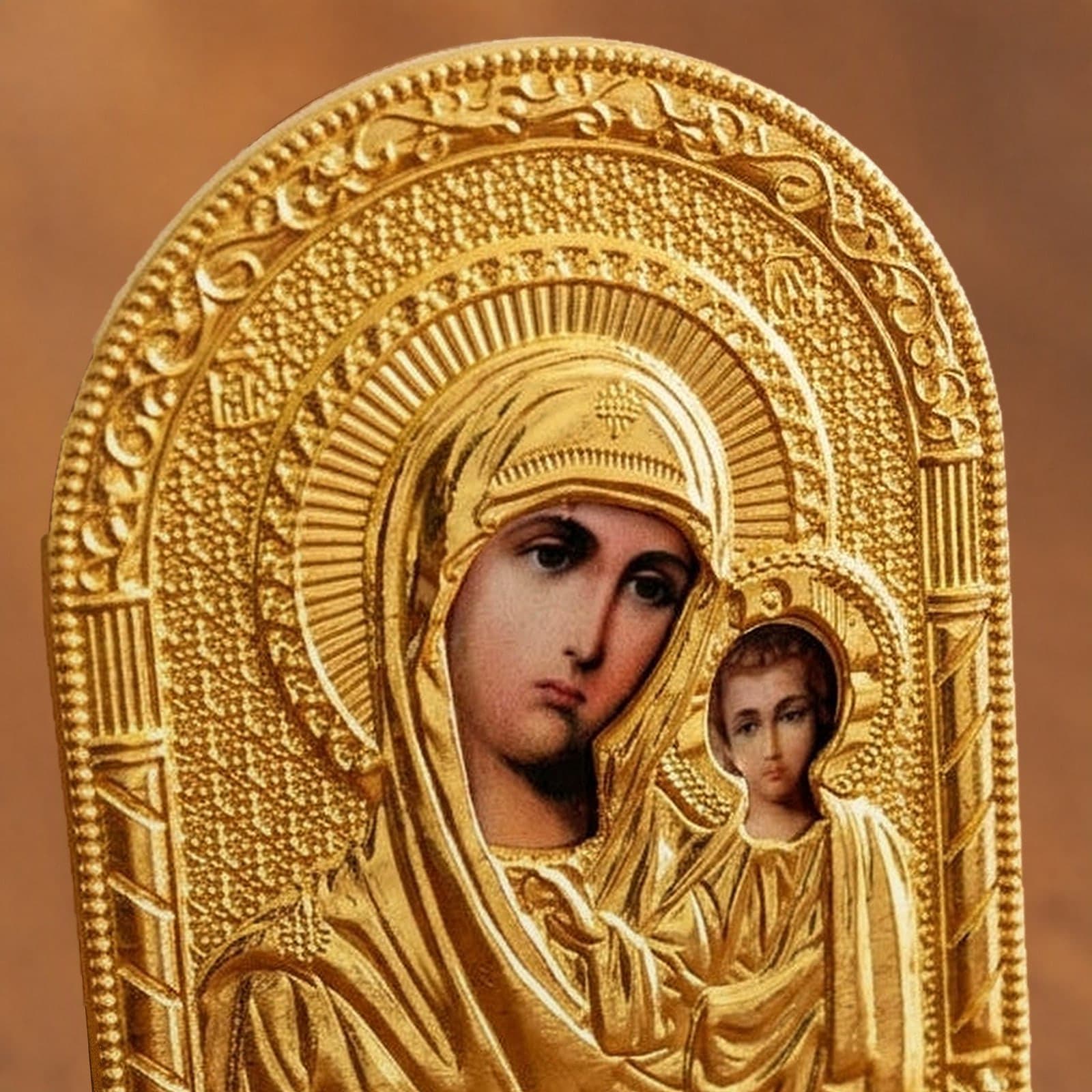 Close-up of the Orthodox Virgin Mary Holding Jesus - Gold Color - Icon: the face, halo and finish.