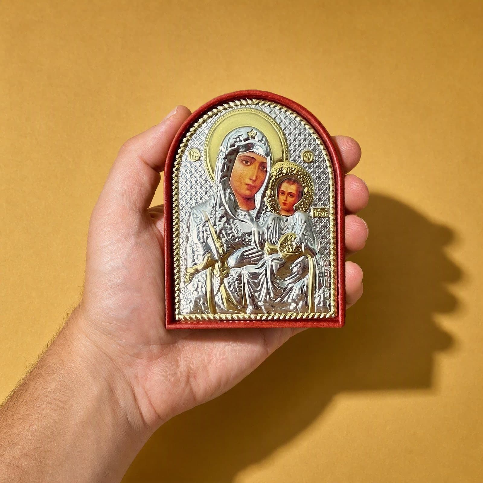 Orthodox Virgin Mary and Child Jesus - Silver&Gold Color - Icon held in one hand to show its size (about 12 x 9 cm).