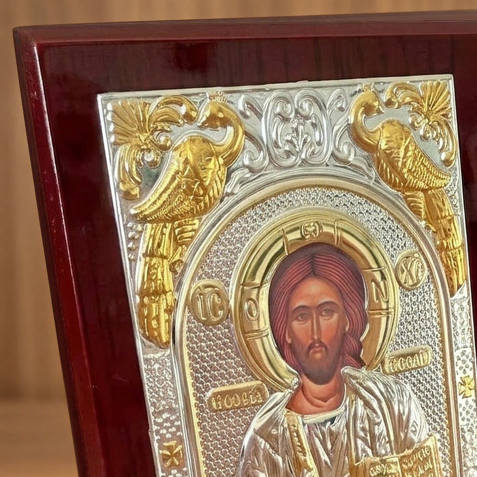 Close-up of the Orthodox Jesus Christ Pantocrator - Silver&Gold Color - Wooden Icon 12х9cm: the face, halo and finish.