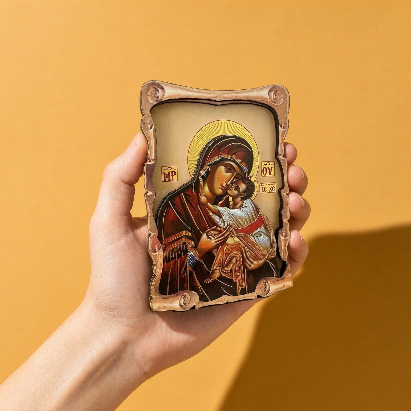 Orthodox Mother of God & Christ - Wooden Icon 14х9cm held in one hand to show its size (about 14 x 9 cm).