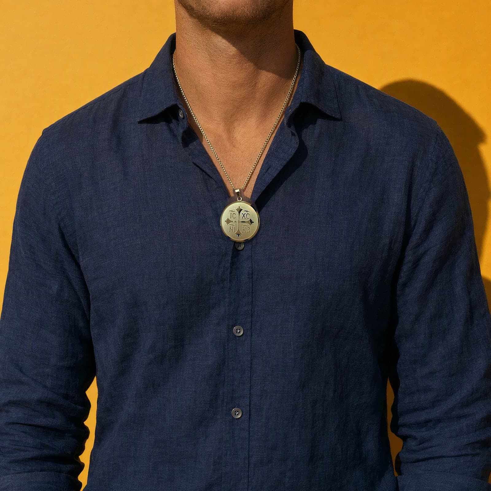 Orthodox IC XC NIKA - Gold Color - Stainless Steel Medallion worn on a man's chest at its true size (5.5 cm).