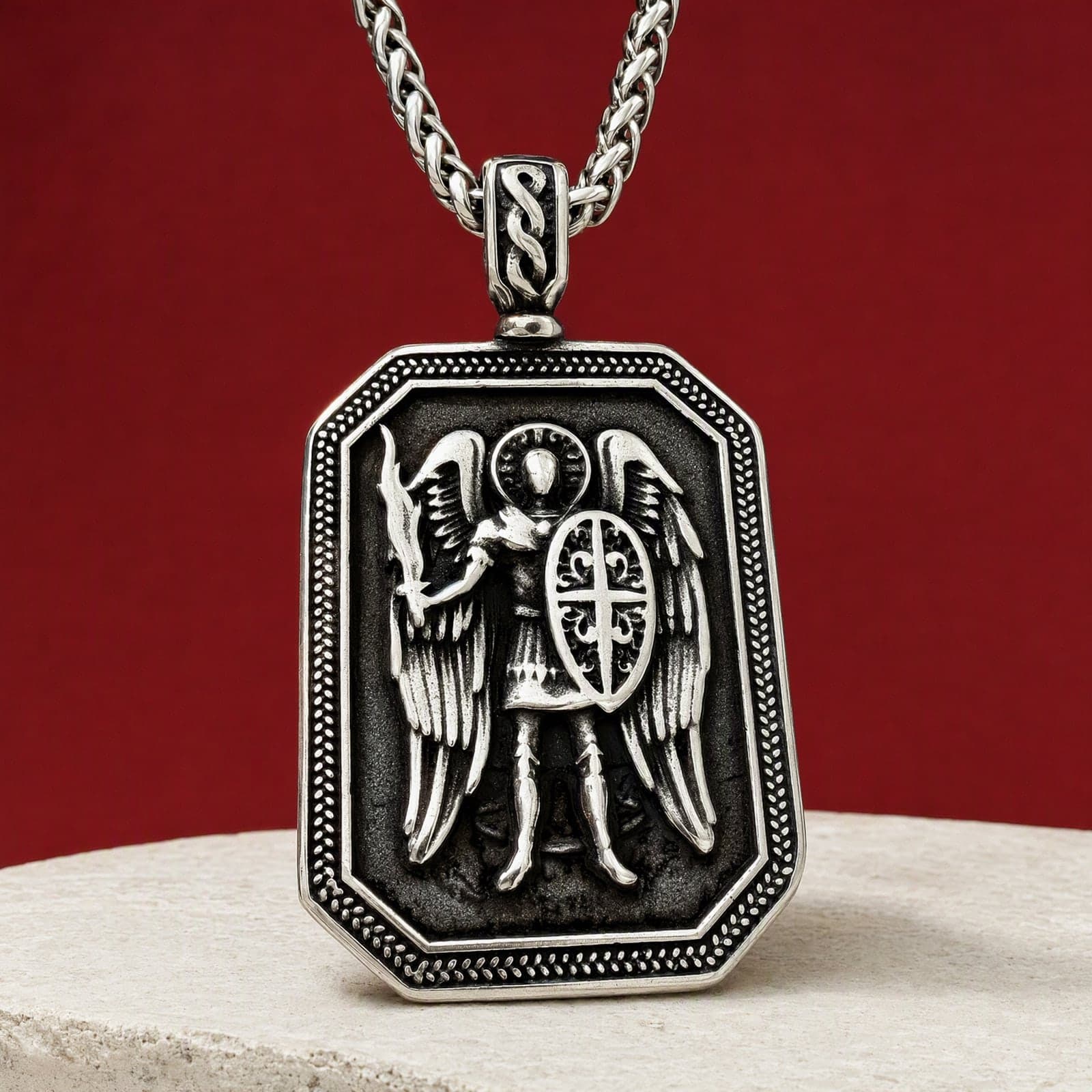 Orthodox St. Michael Archangel, silver-tone stainless steel medallion: close-up of the front relief, on its chain.