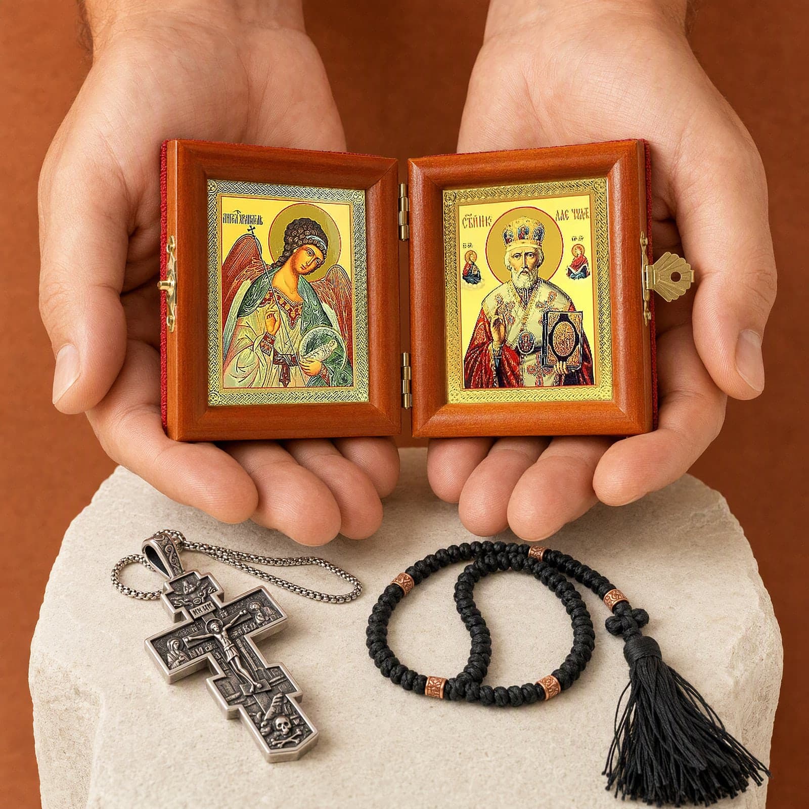 Name-Day Gift Set: the diptych of the Guardian Angel holding a cross and an orb and St Nicholas the Wonderworker in a jewelled mitre holding the Gospel held open in two cupped hands at its true size (16.5 cm wide), the rest of the set on a plinth behind (gift box and saint card not shown).