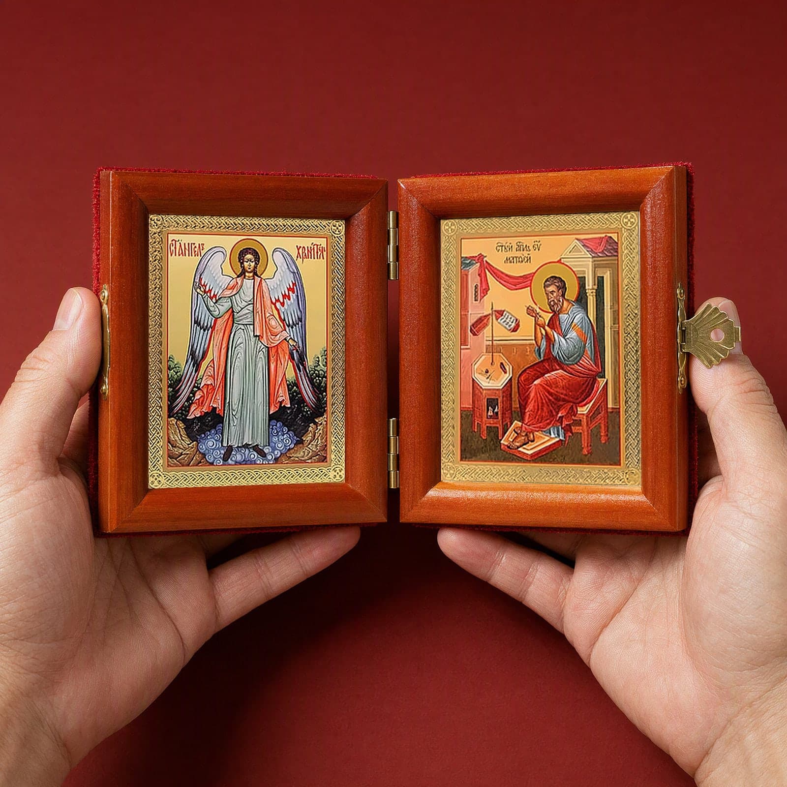 St Matthew the Apostle & Guardian Angel Folding Diptych held open in both hands like a book to show its true size: 16.5 cm wide open, about two palm widths.