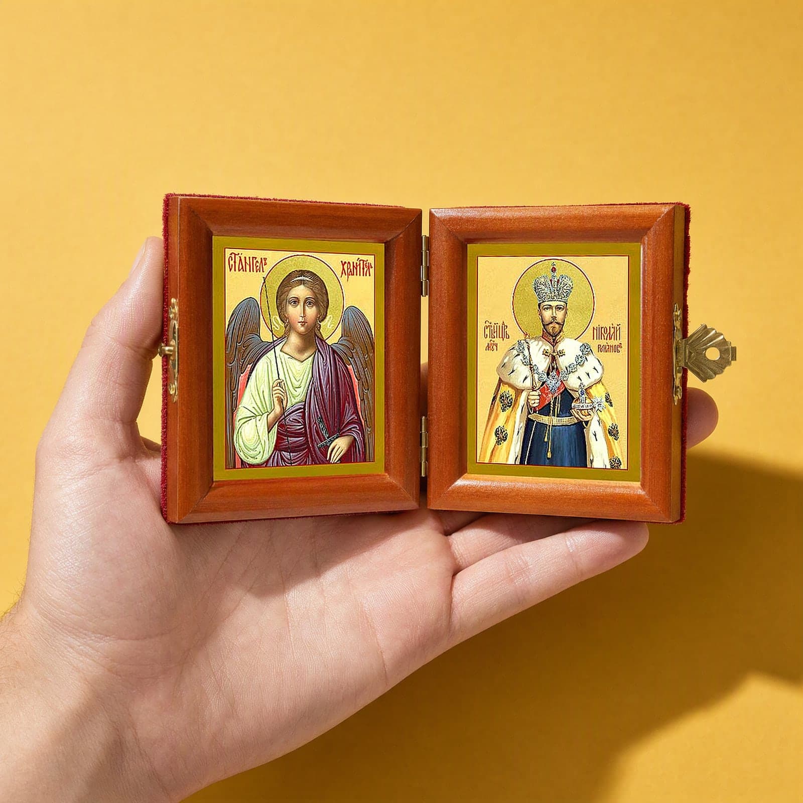 St Nicholas II (passion-bearer) & Guardian Angel name diptych held open in one hand to show its size: 16.5 cm wide open, about two palm widths.