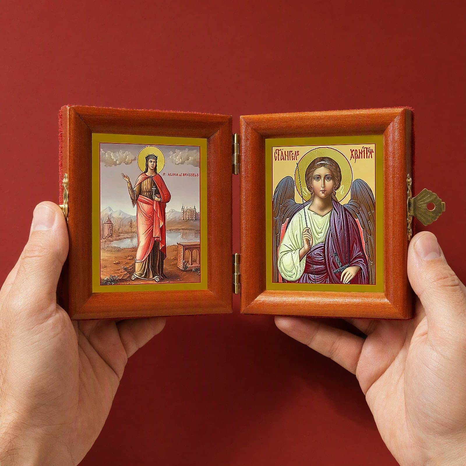 St Alina (Alena) of Brussels & Guardian Angel Folding Diptych held open in both hands like a book to show its true size: 16.5 cm wide open, about two palm widths.