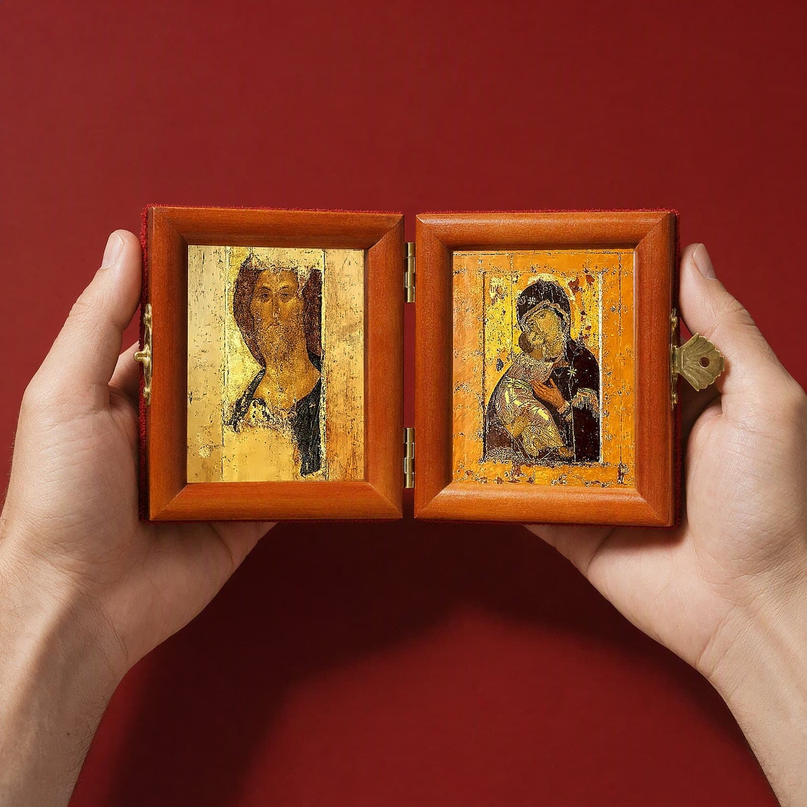Christ (Zvenigorod Saviour) & Vladimir Mother of God Folding Diptych held open in both hands like a book to show its true size: 16.5 cm wide open, about two palm widths.