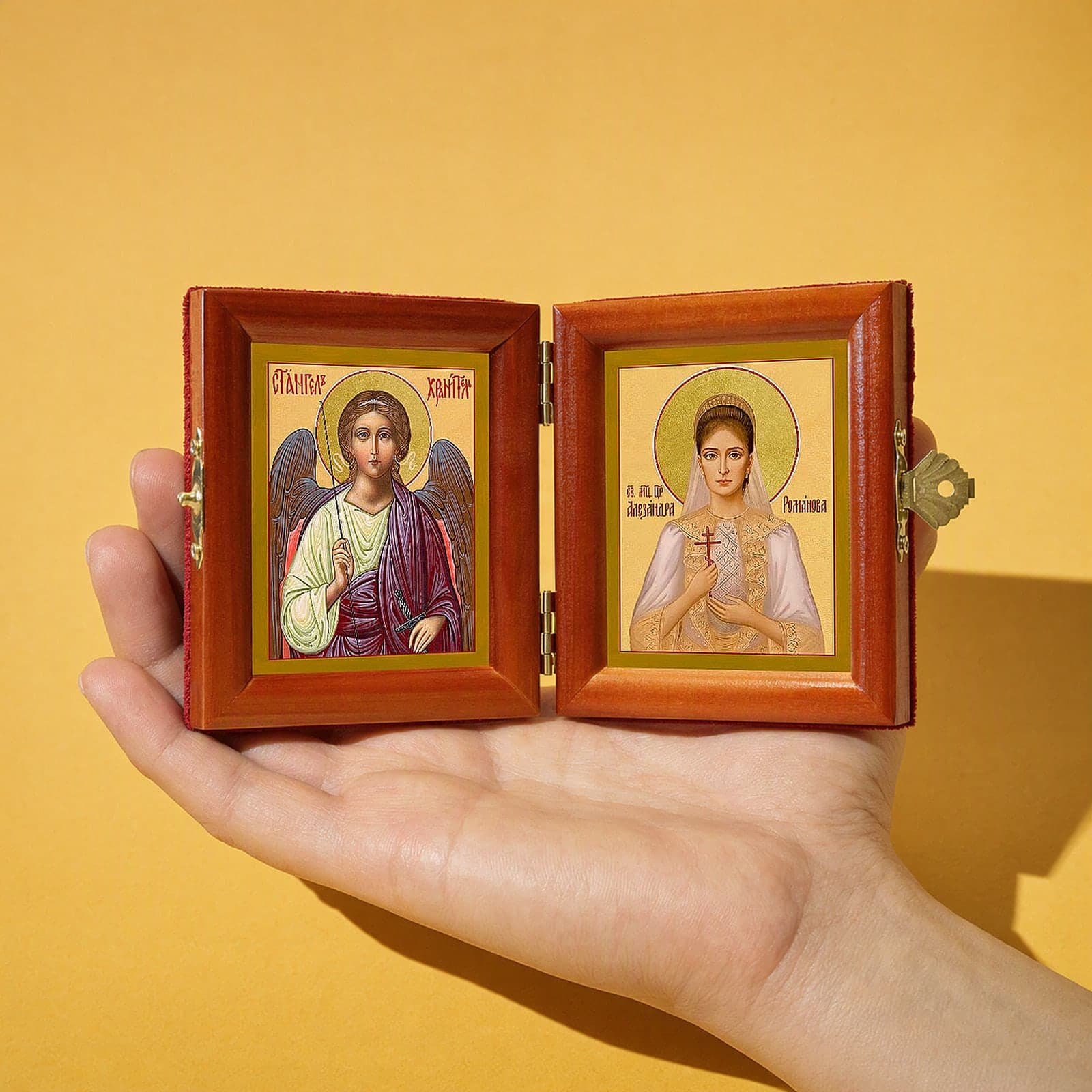 St Alexandra (passion-bearer Empress) & Guardian Angel name diptych held open in one hand to show its size: 16.5 cm wide open, about two palm widths.